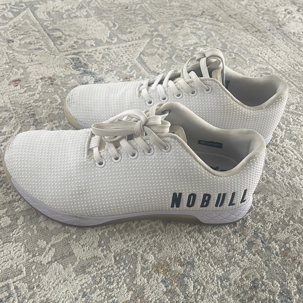 NOBULL white trainers. Men 8.5 / Women 10